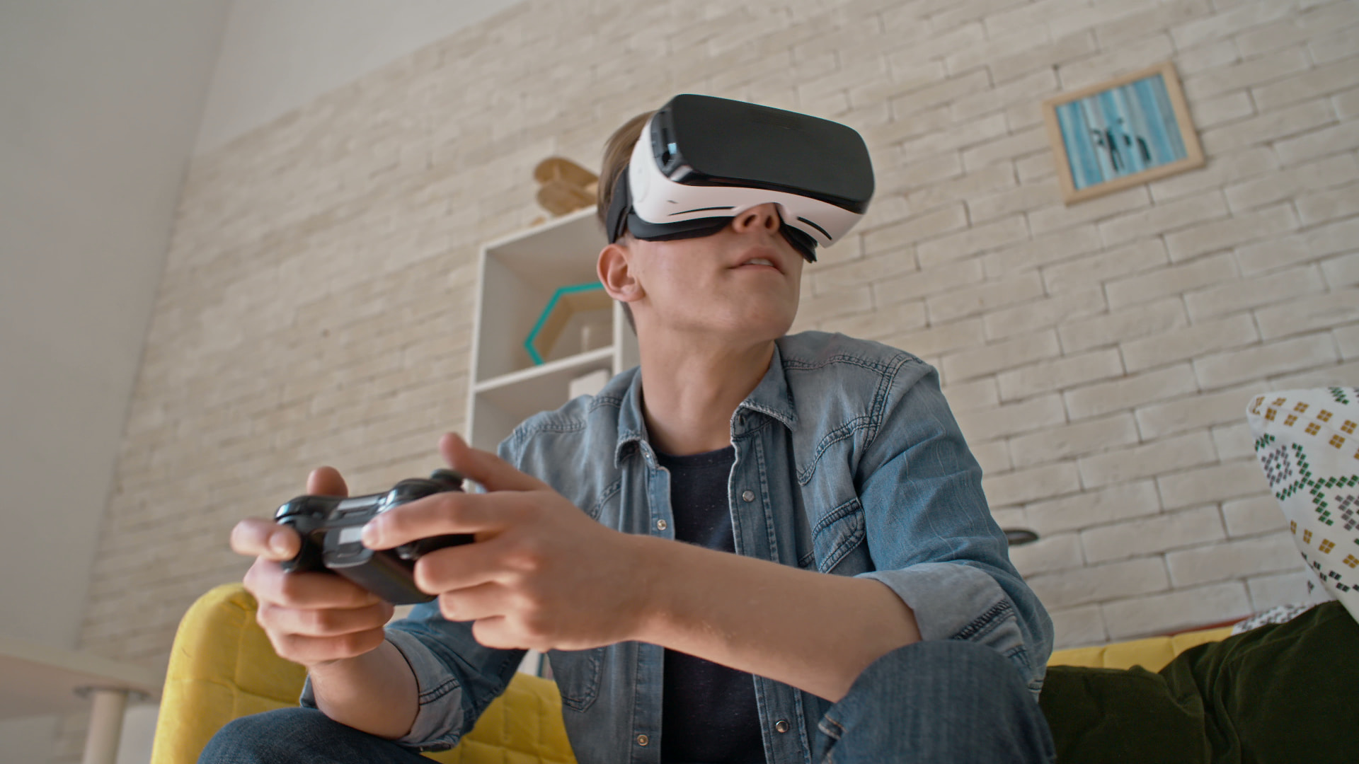 Jover playing video games with VR glasses
